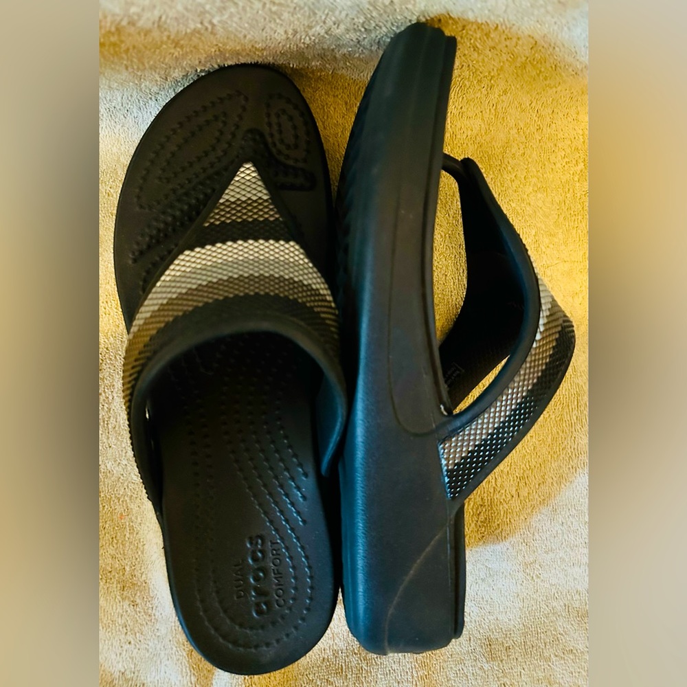 Crocs navy blue flip flops, small platform in style, size 8.